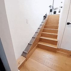 there is a set of stairs leading up to the second floor in this modern home