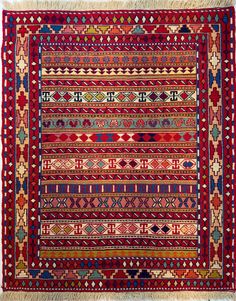 an old rug with many different colors and patterns