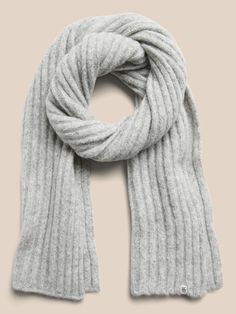 So cozy, this heathered scarf is knitted using one of our softest yarns, spun from a blend of alpaca wool for extra warmth.  Length: 76" (193cm) Width: 12" (30. 5cm) Gray Wool Scarf For Fall, Cozy Soft Wool Knit Scarves, Cozy Solid Soft Knit Scarf, Soft Knit Winter Scarf, One Size, Elegant Luxury Merino Wool Scarves, Ribbed Scarf, Cashmere Scarf, Alpaca Wool, French Girl