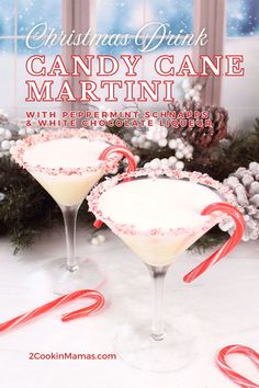 two glasses filled with candy cane martinis on top of a white table next to christmas decorations