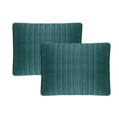 two green pillows sitting next to each other