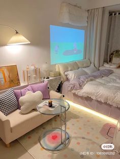 a living room with a couch, bed and projector screen in the middle of it