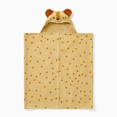 a baby's hooded blanket with a teddy bear on it and polka dot print