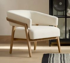 a white chair sitting on top of a hard wood floor