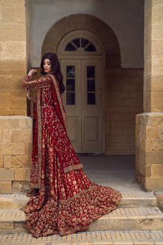 Traditional Red Bridal Lehenga and Kameez Pakistani Wedding Dress is beautifully adorned with goldwork, intricate designs, and embellishments. Premium quality fabric and perfect stitching of this Pakistani Bridal Outfit make it your priority to have a head-turning wedding look. Long Red Wedding Dress, Burgundy Pakistani Bridal, Dark Red Wedding Lehenga, Desi Bridal Outfits, New Bridal Dresses Pakistani, Red Gharara Bridal, Red Wedding Dress Pakistani, Barat Bridal Dress, Baraat Dress Pakistani Bridal Wear