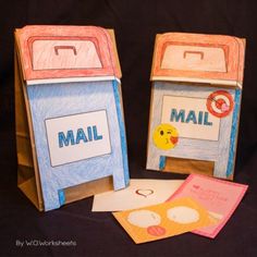 two mail boxes made out of colored paper