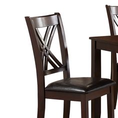 a pair of wooden chairs with leather seat cushions on each side and one chair upholstered at the back