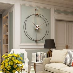 a living room filled with furniture and a large clock mounted to the wall above it