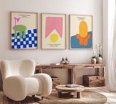 a living room with three paintings on the wall