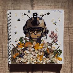 a notebook with an image of a soldier surrounded by flowers and bees on the cover