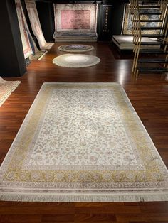 an area rug is on the floor in front of stairs and other carpeting items