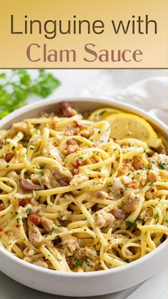 linguinne with clam sauce in a white bowl on top of a table