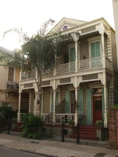 an old house with balconies on the second floor