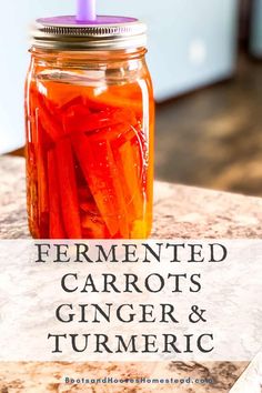 a mason jar filled with carrots and turment sitting on top of a counter