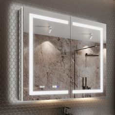 a bathroom with a sink, mirror and lights on the side of the wall in front of it