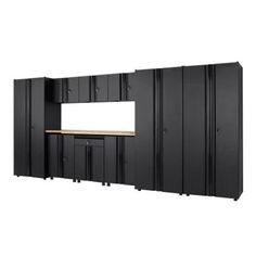 an empty room with black cabinets and shelves