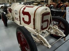 an antique car on display in a museum