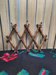 two decorative bamboo sticks are on a rug