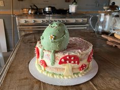 a cake sitting on top of a wooden table