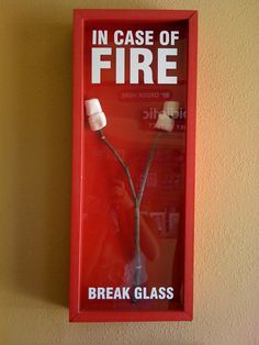 there is a red box with a toothbrush in it that says in case of fire