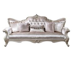 an old fashioned couch with pillows on the top and bottom, sitting against a white background