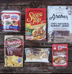 various foods are laid out on a picnic table with chips and crackers next to them