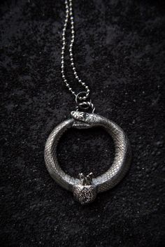 Ouroboros - who eats a tail of himself. Viking symbol of eternity. Alchemy occult symbol as well.✪ DIMENSIONS:  4 cm, weight: 20 g✪ CORD LENGTH: 13-15”/ 35-40 cm + extension chain✪ CUSTOM ORDER INFO: - Contact me personally for custom orders. - All the items are fully handmade and it takes some time to make them. Please visit for timing info: https://goo.gl/1yegFc- Sizes, shapes, some crystals, cords and colors can vary a bit as I like to improvise, but it will always look great and I will alway Ouroboros Jewelry, Alchemy Gothic Jewelry, Alchemy Jewelry, Viking Symbol, Occult Fashion, Gothic Pendant, Occult Symbols, Viking Symbols, Witchy Jewelry