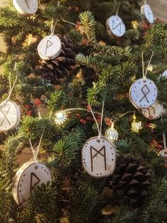 a christmas tree with ornaments hanging from it's branches