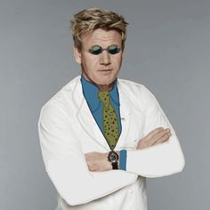 a man in a white coat and tie with his arms crossed, wearing sunglasses on top of his head