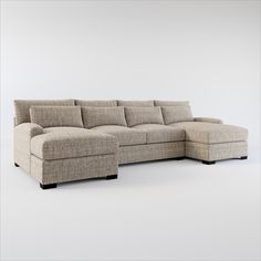 a large sectional couch sitting on top of a white floor