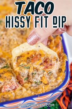 a hand dipping a tortilla chip into a casserole dish with text overlay