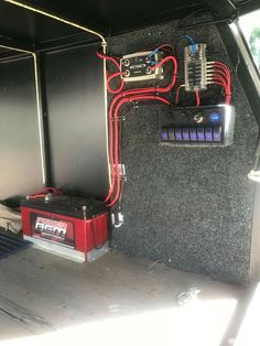 the inside of a vehicle with some electrical equipment in it