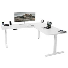 a computer desk with a monitor, keyboard and mouse next to it on a white surface