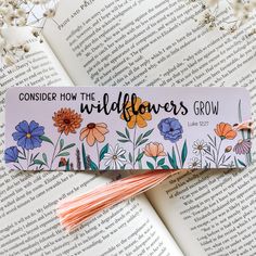 a bookmark with flowers and the words consider how the wildflowers grow