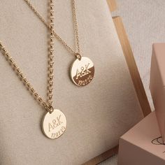 Personalized Couples Necklace Set with Initials and Anniversary Date Now you, or a loved one or special friend, can make a stylish and personal fashion statement with this elegant Personalized Couples Necklace Set with Initials and Anniversary Date. This exquisite personalized couples necklace set will make a very thoughtful gift for someone special, and will be greatly appreciated for years to come. The personalized couples necklace set includes two necklaces with round pendants featuring two i Gold Jewelry With Engraving Option For Wedding, Elegant Customizable Necklace For Anniversary Gift, Elegant Customizable Necklace For Anniversary, Personalized White Gold Necklace For Gift, Classic Necklaces For Anniversary And Mother's Day, Classic Necklaces For Mother's Day Anniversary, Classic Personalized Necklace For Anniversary, Classic Personalized Necklaces For Anniversary, Classic Personalized Anniversary Necklace