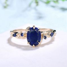 Nature Inspired Natural Lapis Lazuli Ring Vintage 1.5ct Oval Lapis Lazuli Engagement Ring Leaf Blue Sapphire Dainty Wedding Ring For Women ≫≫ Item Details  Make every ring to order, all rings are handmade in the United States.  Metal: Solid 10K & 14K & 18K Gold  Gold Color: Rose gold, Yellow gold, White gold ➽ Center Stone 6x8mm oval cut Nature Lapis Lazuli ➽ Accent Stone:lab created sapphire The band width is about 1.4mm ➽THE BEST QUALITY CRAFTSMANSHIP: All rings for women at Yridesign are made Lapis Wedding Ring, Lapis Lazuli Ring Gold, Lapis Engagement Ring, Lapis Lazuli Rings Women, Lapis Lazuli Ring Vintage, Lapiz Lazuli Ring, Lapis Lazuli Engagement Ring, Lapis Rings, Navy Blue Ring