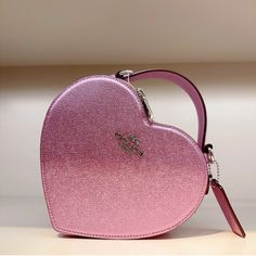 Beautiful Metallic Pale Pinkish Purple Heart Shaped Bag. Coach Leather Statement Purse. Love And Valentine's Day. Treat Yourself Leather Heart-shaped Bag With Detachable Strap, Pink Formal Bag For Valentine's Day, Pink Top Handle Bag For Valentine's Day, Leather Shoulder Bag For Valentine's Day Evening, Luxury Purple Bags For Gifts, Luxury Purple Bag For Gift, Valentine's Day Leather Shoulder Bag For Evening, Leather Shoulder Bag For Evening And Valentine's Day, Pink Heart-shaped Bag With Detachable Strap