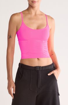 A touch of shirring shapes a supportive cami with slender crossback straps and a scoop neck. 16" Length (Size M/L) Scoop neck Fixed straps 86% polyamide, 14% elastane Machine wash, dry flat By Free People; imported Fitted Pink Tank Top With Built-in Bra, Strappy Stretch Tank Top With Built-in Bra, Fitted Sleeveless Tank Top With Ruched Back, Yoga Strappy Tank Top, Fitted Sports Camisole With Built-in Bra, Summer Stretch Tank Top With Ruched Back, Pink Scoop Neck Camisole With Adjustable Straps, Pink Camisole With Adjustable Straps And Scoop Neck, Stretch Tank Top With Ruched Back For Summer