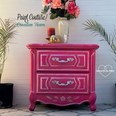 a pink painted dresser with flowers in a vase next to it and the words paint culture creative team