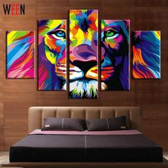 colorful lion painting on the wall next to a bed