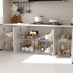 an organized kitchen with lots of food and utensils