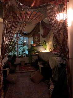 a bed room with a canopy and some plants