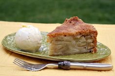 a piece of pie and ice cream on a green plate