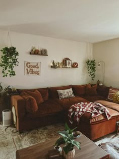 a living room filled with furniture and plants