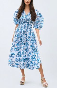 The hand-illustrated floral dress is made from poplin fabric and features a smocked panel, V-neckline, three-quarter length puff sleeves, and a rear tie fastening. Each print is carefully hand-painted in our New York design studio, and the dress comes in a high-end gift box. 100% Poplin Smocked panel Rear tie fastening Side-seam pockets Toile Dress, New York Design, V Neck Midi Dress, Blue Midi Dress, Poplin Fabric, Nordstrom Dresses, Puff Sleeves, Three Quarter, Floral Dress