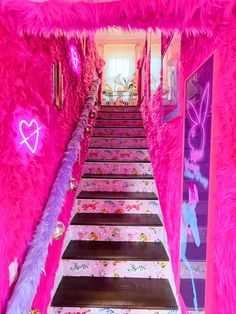 the stairs are decorated with pink and purple decorations