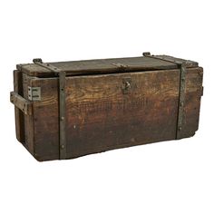 an old wooden chest with metal handles