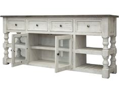 an old white wooden sideboard with drawers and shelves on the bottom, isolated against a white background