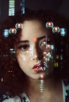 a woman's face is surrounded by bubbles in the shape of her head and eyes