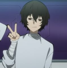 an anime character is making the peace sign with his hand and pointing at something in front of him